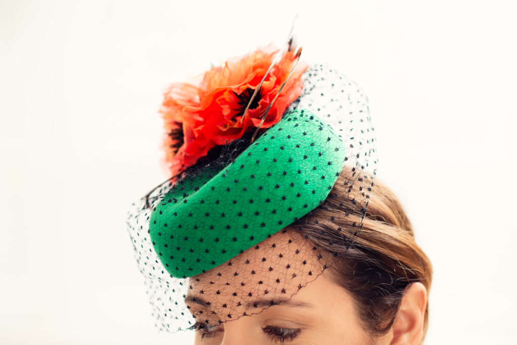 Green felt pillbox hat with orange silk poppies and pheasant feathers